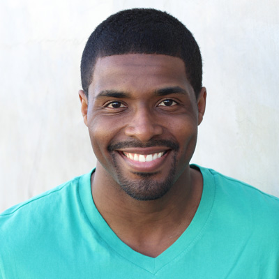 An elderly couple sharing a joyful moment together outdoors.